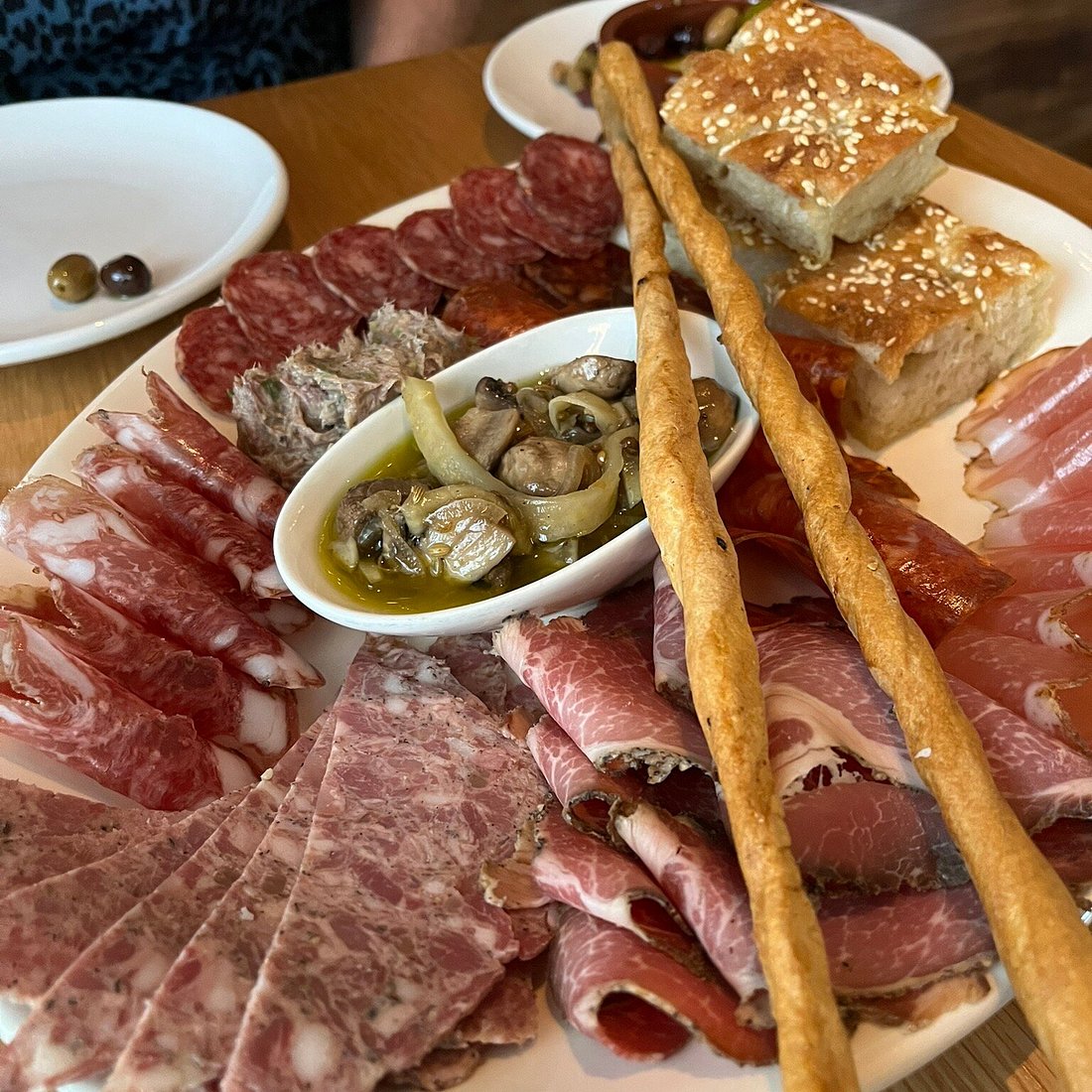 Lucia signature dishes Tagliatelle with Foie Gras and ProsciuttoSalumi Misti (House-Cured Meats)Seasonal Pasta Dishes